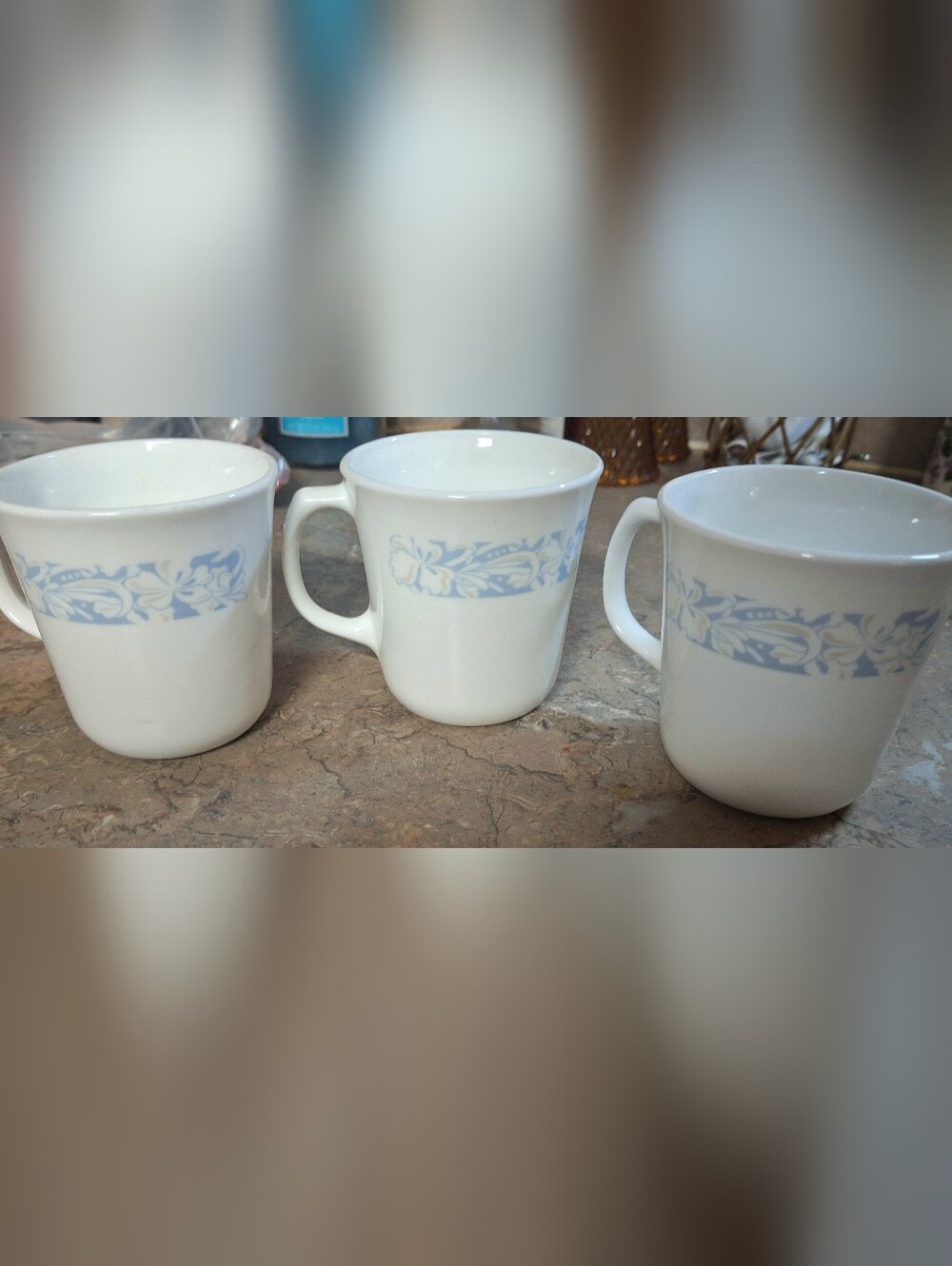 White Ceramic Mugs with Pale Blue Floral Band - Set of 3 One Mug Has A Stain.